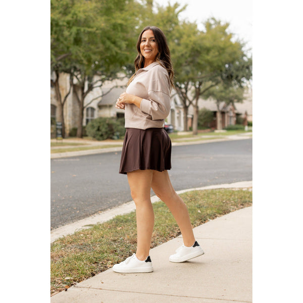 Stretchy brown Julia Rose skort styled for casual wear